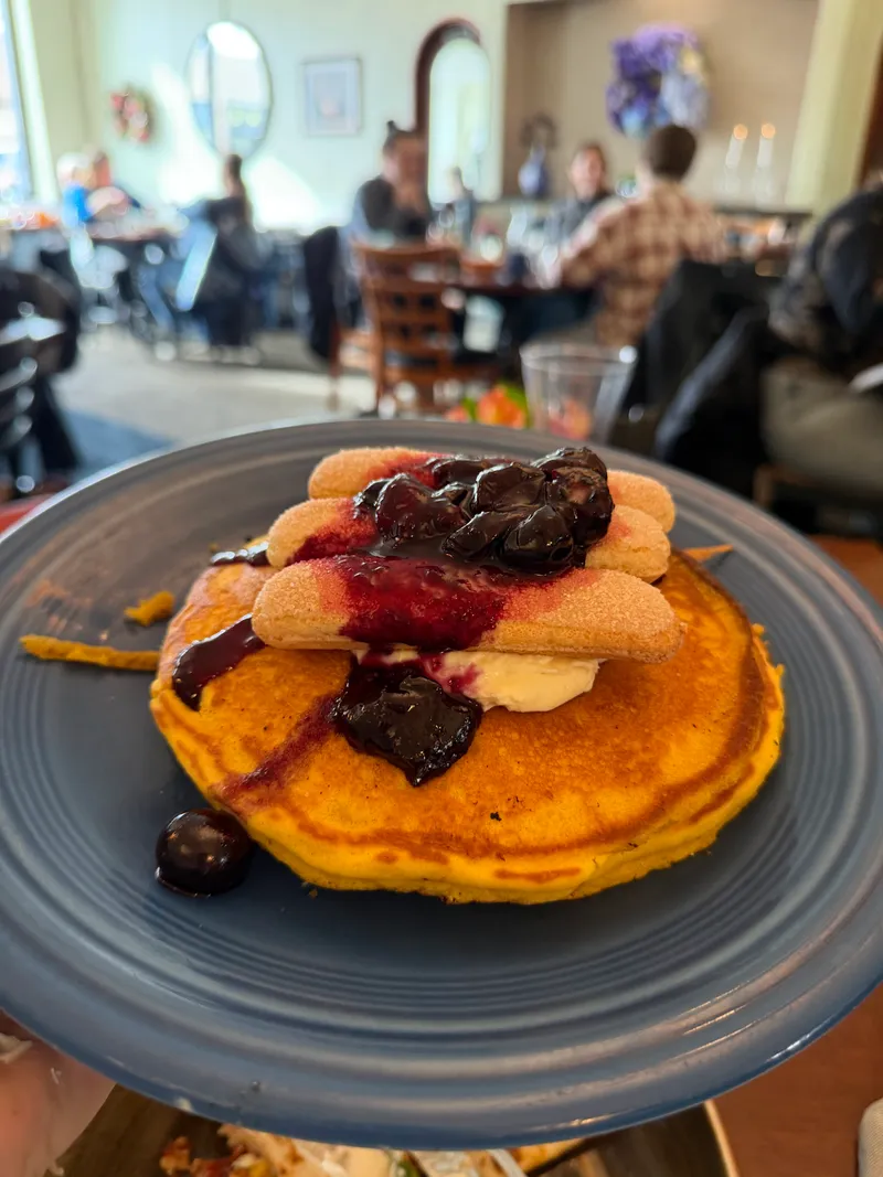 Weekend special: lemon tiramisu pancakes with blueberry compote and ladyfingers, dining room behind